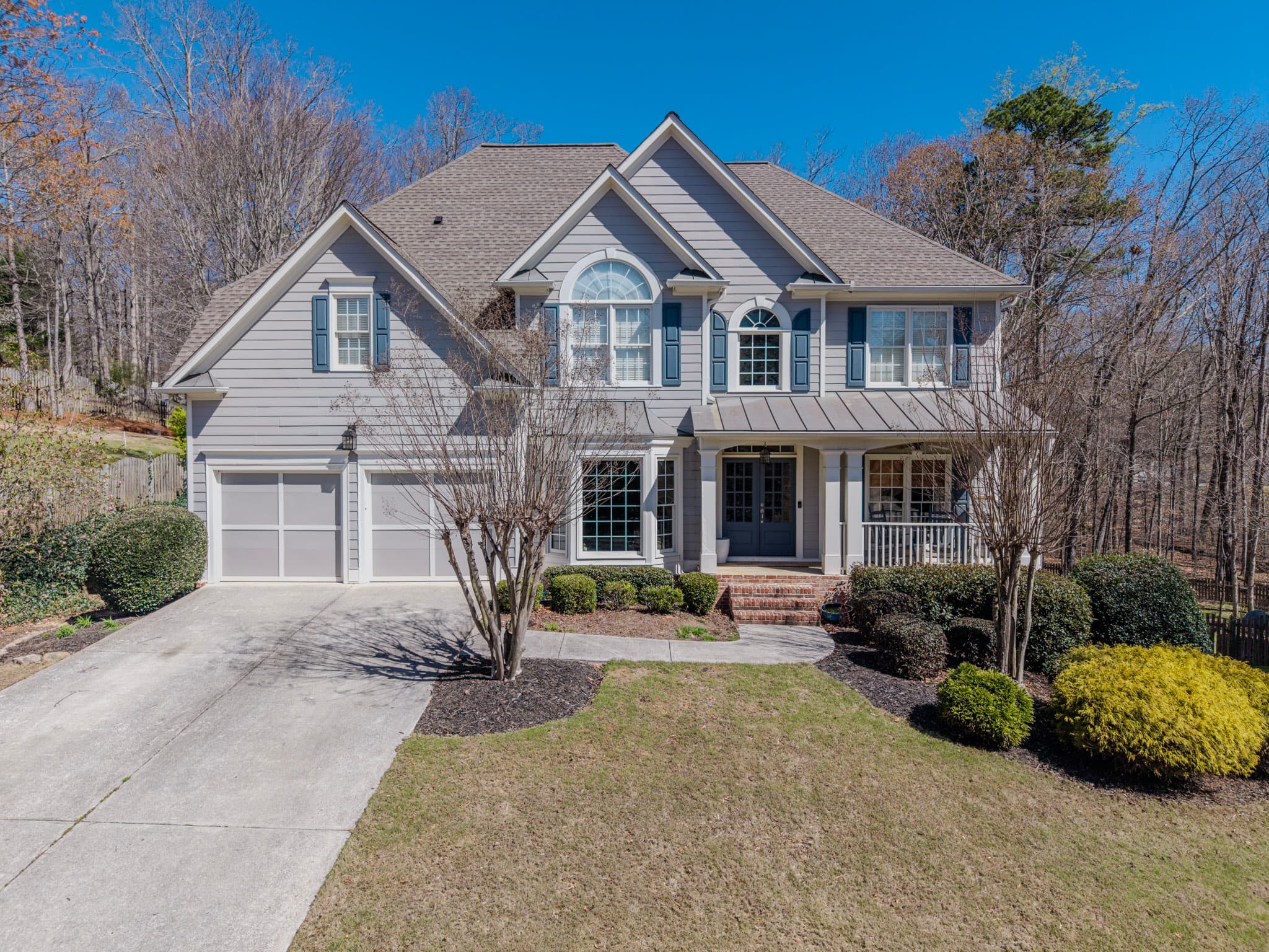Aerial view of a residential home and yard from above